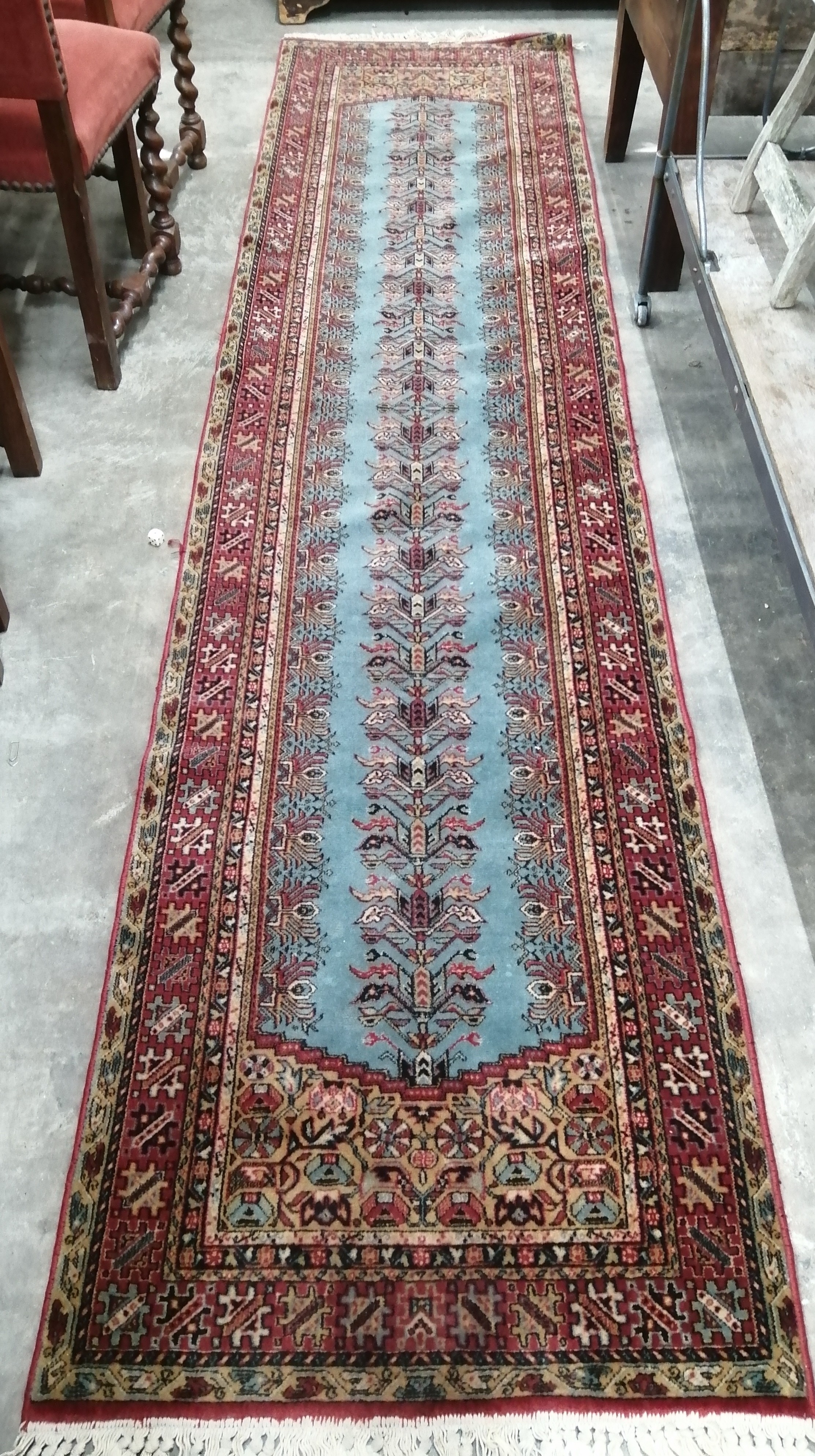 A Caucasian blue ground runner (a/f), 300 x 94cm together with a North West Persian style machined blue ground runner